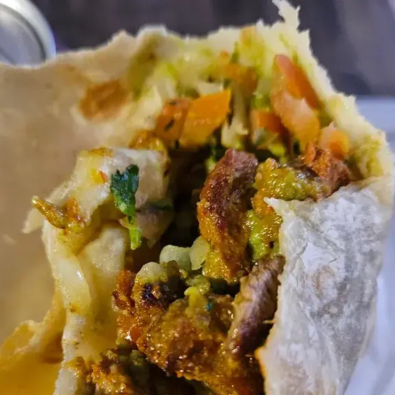 Street taco with carne asada cilantro onion and salsa