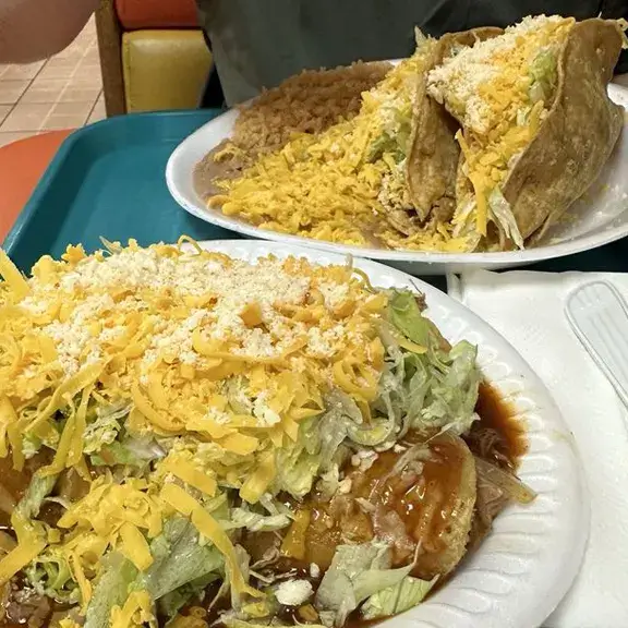 Mexican combo plate with tacos rice and beans